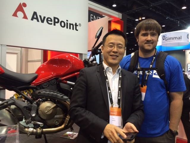 Ducati winner posing with his new Ducati Monster 821 and AvePoint co-CEO and co-founder, Dr. Tianyi "TJ" Jiang